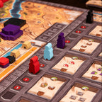 Board game with player pieces on a map