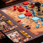 Board game with colorful pieces on a detailed map