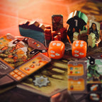 Board game with cards, dice, and character figures on a table