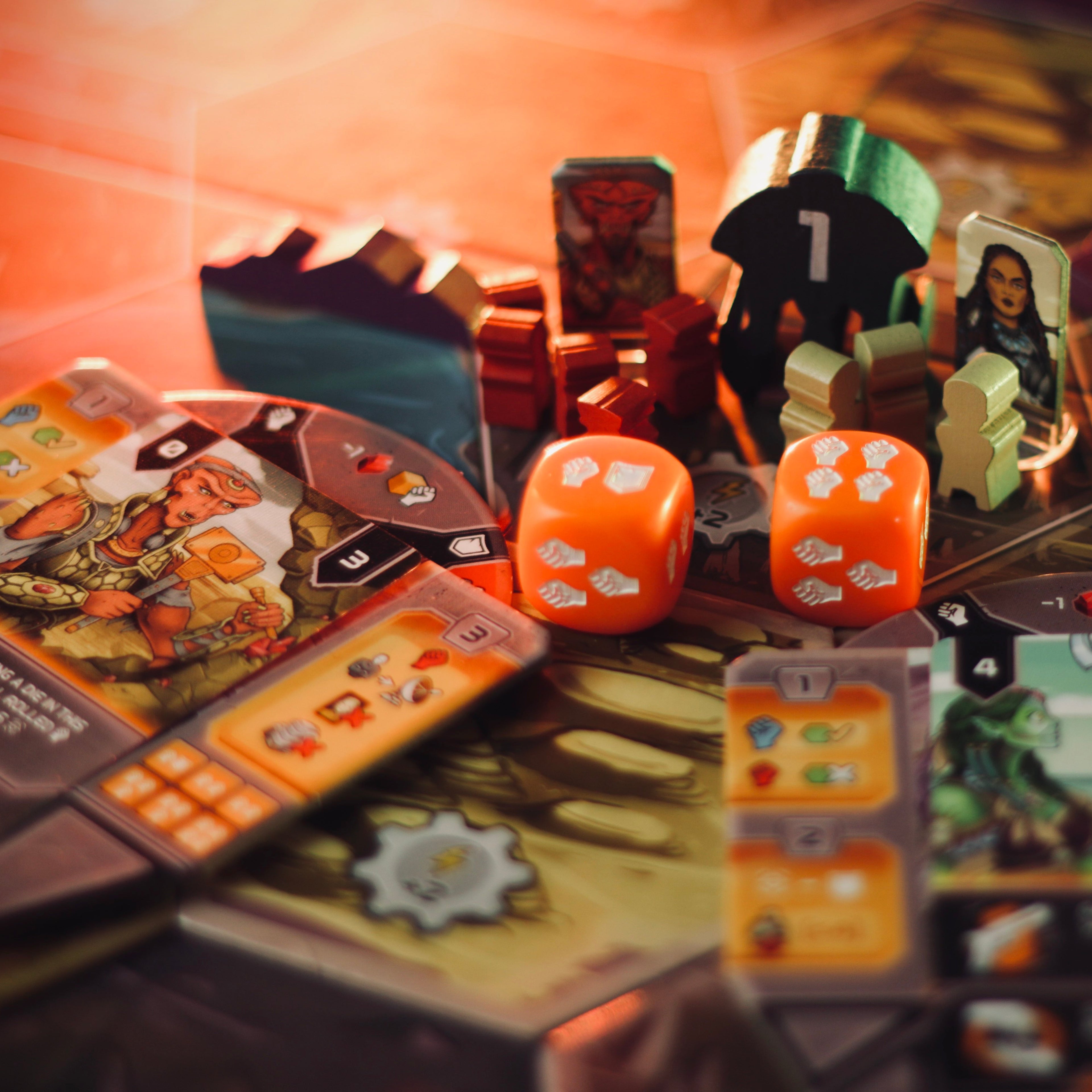 Board game with cards, dice, and character figures on a table