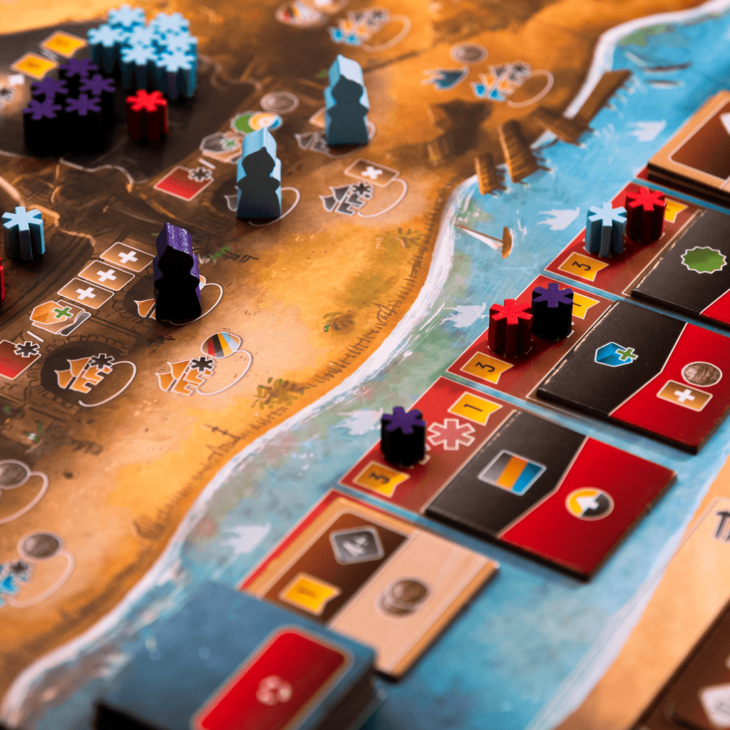 Board game with colorful pieces and cards on a map-like board