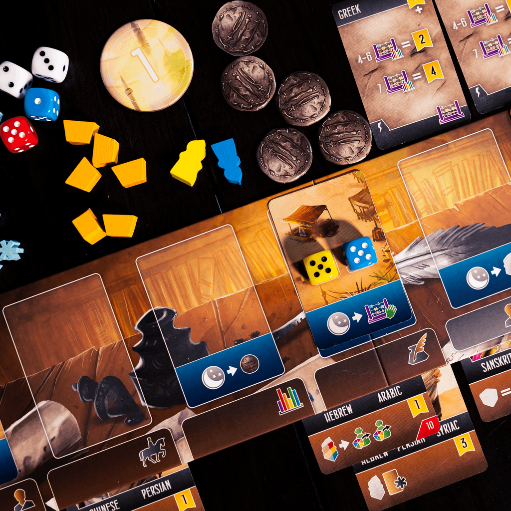 Board game with cards, dice, and game pieces on a dark surface