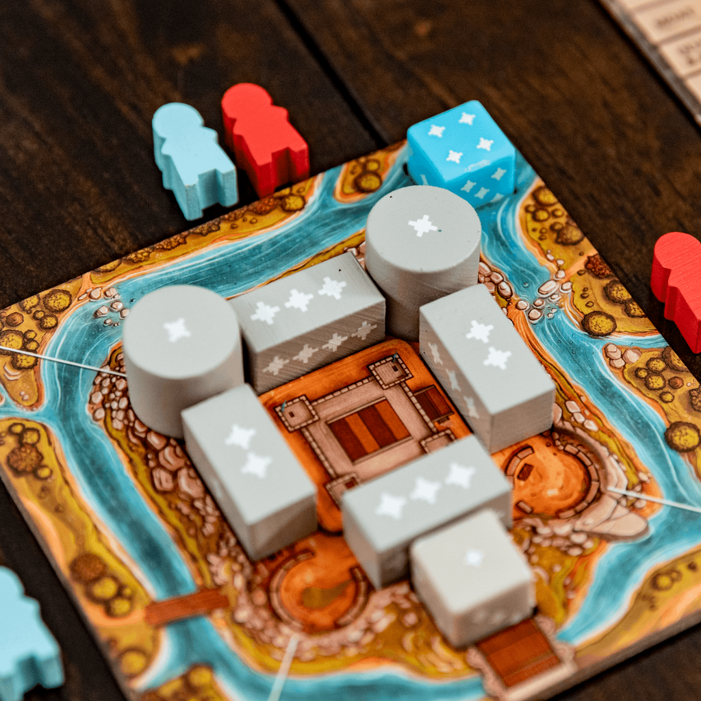 Board game with dice and pieces on a wooden surface